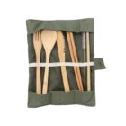 A set of bamboo cutlery including a fork, spoon, knife, chopsticks, straw, and cleaning brush wrapped in a green canvas pouch with a button closure.