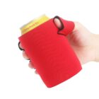 A hand holding a yellow can covered in a red foam sleeve. The sleeve has a handle and thumb hole, providing a comfortable grip. The cans label is partially visible, revealing text with a mention of Peach Tea. The background is plain white.