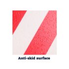 Close-up of a textured anti-skid surface with diagonal red and white stripes. The texture is visible with small, raised patterns. Text below reads Anti-skid surface.