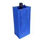 A blue wine bottle gift bag with two rope handles is shown. The top of a wine bottle is visible peeking out from the open bag.