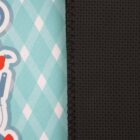 Close-up of a mouse pad design. On the left, a patterned fabric with blue and white diamonds and part of a colorful graphic. On the right, a textured black surface. The seam runs vertically between the two sections.