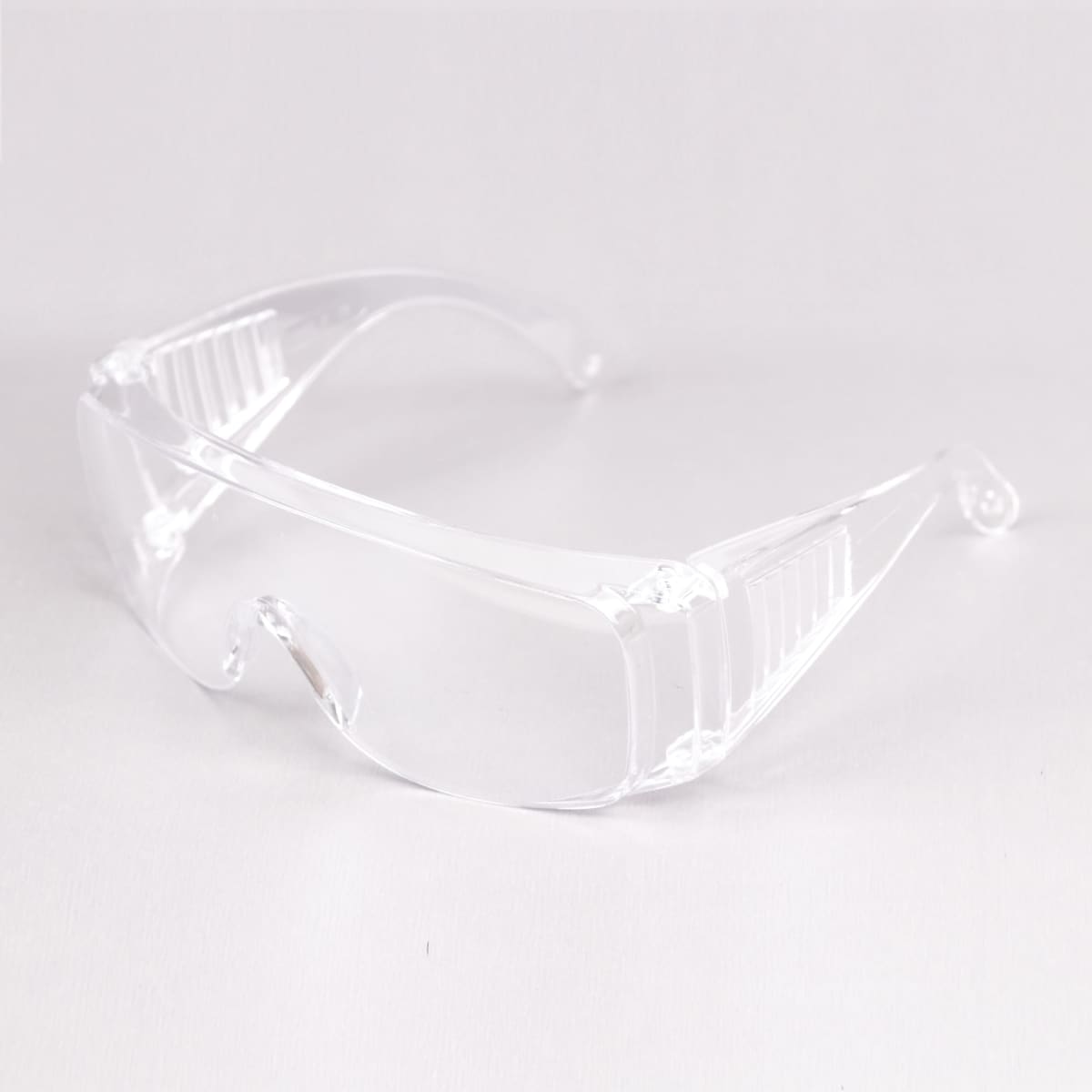 Clear safety glasses with a wraparound design on a white background.