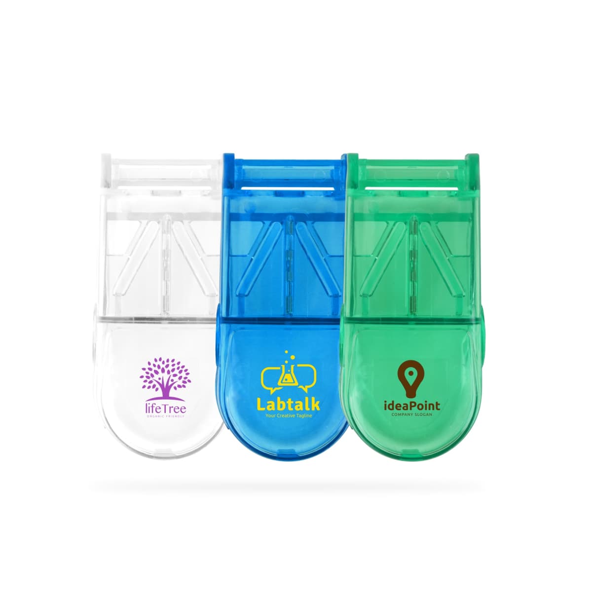 Three plastic pill cutters in white, blue, and green, lined up side by side. Each cutter has a logo: a tree for lifeTree, a lab flask for Labtalk, and a location pin for ideaPoint.