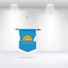 A blue hanging banner with tassels features a sun logo and text reading Mair Foods. The banner is suspended under two spotlights in a minimalist room, casting faint shadows on the floor.