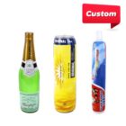 Three beverage containers: a green champagne bottle with a gold cap, a tall yellow can with a floral design labeled Original, and a red and blue tube with a white cap, labeled Slimed Typose. A Custom label is at the top right.