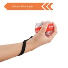 A hand holding a small gyroscope hand trainer with a red band labeled Power Ball. The hand is secured with a black strap. An orange label above states Non slip silicone grip.