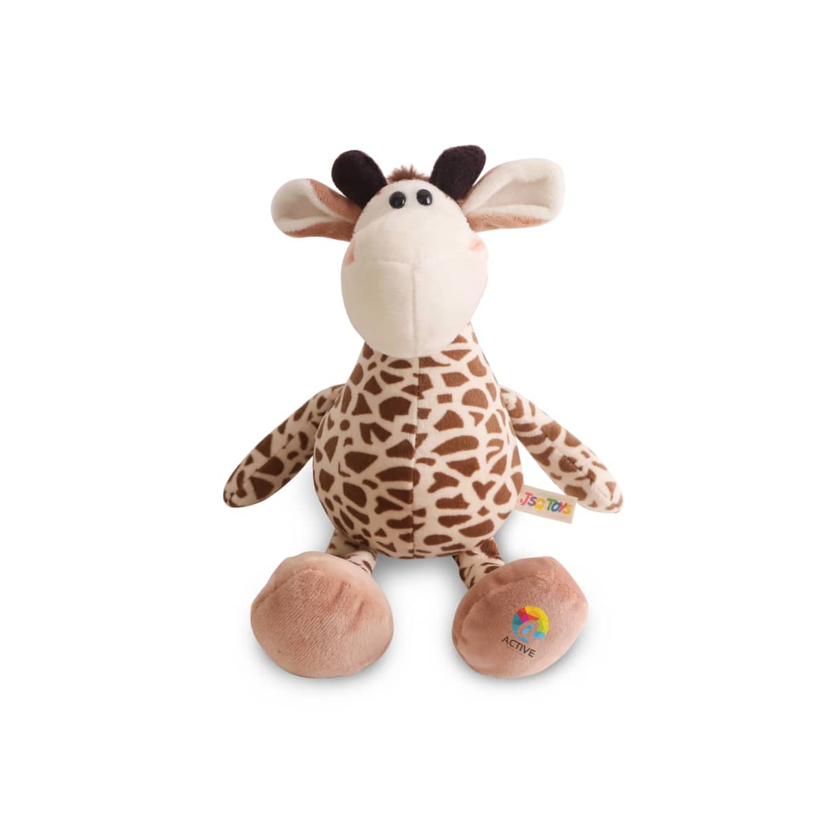 A plush toy giraffe with a cute expression, featuring a brown and cream spotted pattern, brown ears, and large beige feet. It has a tag on its side with colorful graphics. The toy is sitting against a white background.