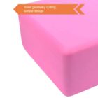 A close-up of a pink foam block with a smooth surface. A caption on the image reads, Solid geometry cutting, simple design, with an arrow pointing towards the block.