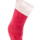 A red and white Christmas stocking with a hanging loop, standing upright against a white background.