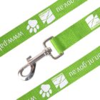 A green dog leash with white symbols and text featuring a metal clip. The design includes a paw print and www.palmerston text repeatedly along the length.