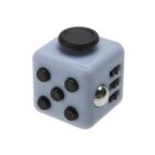 A gray fidget cube featuring various tactile elements: five black buttons on one side, a black dial on the top, a metallic ball and three dials on another side. Designed for stress relief and sensory play.