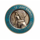 Circular medal for the Hospital of Saint Raphael, featuring a relief of a person in profile wearing a hood. Surrounded by the text Seton Excellence Award on a teal border.