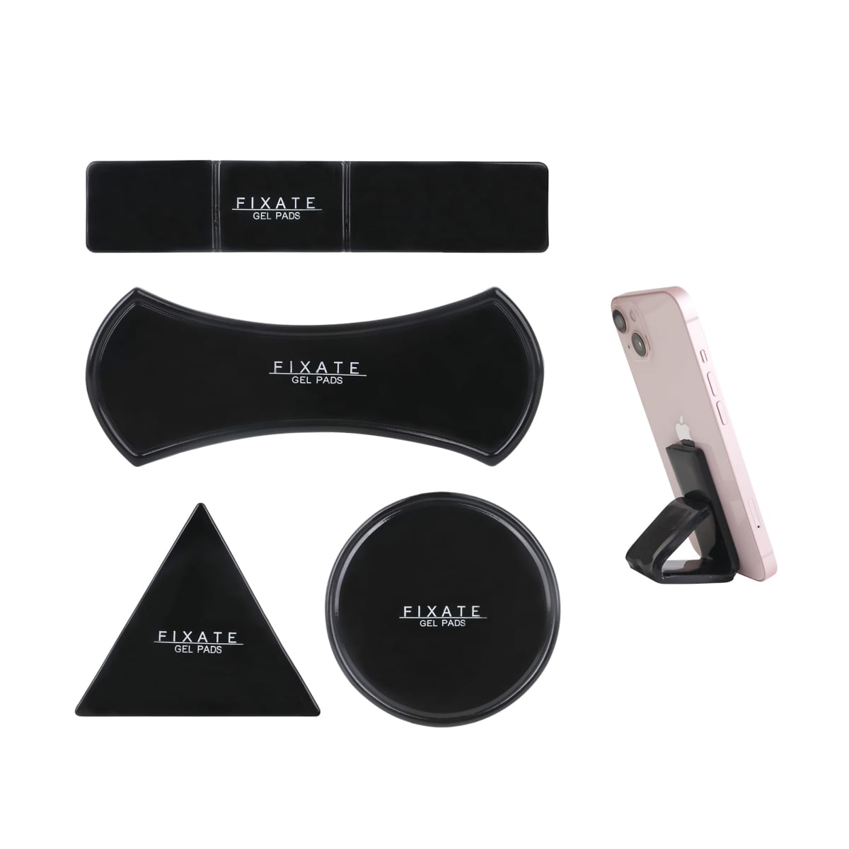 A collection of Fixate gel pads in various shapes: rectangular, curved, triangular, and circular, alongside a smartphone supported by a gel pad stand. All gel pads are black with Fixate Gel Pads text.