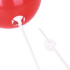 A close-up of a red balloon attached to a white plastic stick with a cup holder. Another white plastic balloon stick with a cup holder is positioned beside it. The background is plain white.