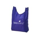 A reusable blue shopping bag with bioisland and a butterfly logo printed on the side.