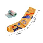 A single yellow sock with blue and orange abstract shapes is displayed, measuring 230mm in height and 200mm in length. Another rolled-up sock with a different pattern is in the background.