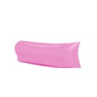 A bright pink inflatable air lounger with a simple, streamlined design, resembling a long cushion. It appears soft and is likely used for outdoor relaxation. The lounger is set against a plain white background.