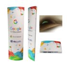 Two standing cardboard promotional displays for Google for Education and Chromebook, with colorful geometric patterns. A small insert shows a close-up of the box opening.