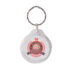 A round keychain with a label inside that reads Moorabbin Cricket Club - 100 Games in red and black. The label includes the years 1924 and 2016 along with red laurel branches.