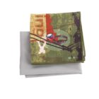 A folded blanket featuring a vintage-style airplane graphic on a green and red background is stacked on a plain gray blanket. The top blanket includes design elements like a compass and map motifs, adding to its adventurous theme.
