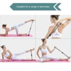 Four images of a person in a white outfit demonstrating resistance band exercises on a pink mat. Exercises include leg raises and arm stretches, with a note stating, Suitable for a range of exercises at the top.