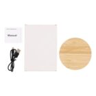 A wireless charging pad set includes a round bamboo charging pad, a USB cable, a user manual, and a plain white box.