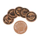 Six round cork coasters are displayed. Five have various designs with geometric shapes and the word EXILE in black. One coaster features a white print of a shell.