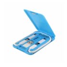 Blue portable case containing a white multi-functional USB cable set with various connectors including USB-A and USB-C. The case is open, displaying the neatly organized cables inside.