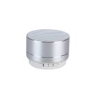 A silver cylindrical Bluetooth speaker with a perforated top for sound output. It has buttons on the side for controls. The design is sleek and minimalistic, suitable for portable audio use.