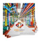 A vibrant industrial facility with a network of colorful pipes in green, blue, yellow, red, and orange. The image features the Coolplay Great Solutions logo, emphasizing great cooling solutions.
