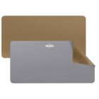 A reversible desk mat shown in two colors: one side is gray, and the other is brown. The corner of the mat is flipped to display both colors, with a small brand logo in the center.