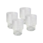 Four Alva Glass Tumblers Ribbed, featuring a modern textured design with vertical grooves, are displayed on a white background, adding elegance to any table setting.