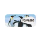 Three penguins standing on ice, with blue sky in the background. One penguin is touching two others on their shoulders. There is an oval-shaped area with the text YOUR LOGO on the right side of the image.