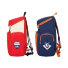 Two backpacks are displayed side by side. The left one is red with a logo and the word TASTE. The right one is blue with orange trim and a football club logo featuring a soccer ball. Both have multiple zippered compartments.