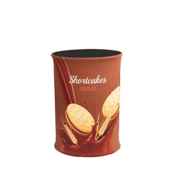 A cylindrical brown container with the text Shortcakes Chocolate. The packaging features images of cookies and wheat with a splash of chocolate.