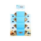 Flat-packed blue and brown cardboard display stand with desert-themed graphics, labeled doxer at the top. The stand appears to have foldable compartments and handles for easy assembly and transport.