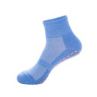A blue ankle sock with grip dots on the bottom is displayed against a white background. The sock features a textured design for added comfort and style.