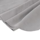 Close-up of a soft gray fabric with a smooth texture, showing gentle folds and curved edges. The fabrics surface appears plush and velvety, reflecting light slightly.
