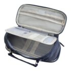 Open travel toiletry bag in blue fabric with a handle. The bag is unzipped, showing multiple compartments, including mesh pockets and elastic bands, for organizing items.