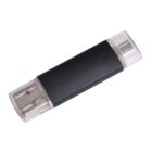 A black USB flash drive with transparent plastic caps at both ends, revealing the USB connector on one side and a micro USB connector on the other. The drive is positioned diagonally against a white background.