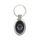 Oval keychain with a silver metallic frame, featuring a black center with a geometric lion face design in gray. The keychain has a round metal ring attached at the top.
