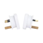 Two white electrical plug adapters with three prongs each, including two flat and one rectangular prong, arranged side by side on a plain white background.