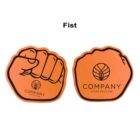 Two foam hand shapes side by side, both resembling a fist. The left one shows the back of a closed hand; the right one includes a logo with the word Company and a tagline. Both are orange with black outlines.