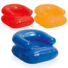 Three inflatable chairs: one red, one yellow, and one blue with a logo. Each has a rounded backrest and seat, resembling a plush armchair. The chairs are displayed against a white background.
