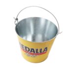 Yellow metal bucket with a silver interior and a handle. The bucket has Medalla Light written on it in bold letters. The bucket is intended for holding ice, bottles, or cans.