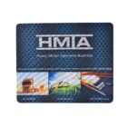 A promotional mouse pad for Heavy Motor Insurance Australia (HMIA) with images of a truck, farm machinery, and a van on a blue dotted background. Contact details are included at the bottom.