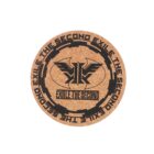 A round cork coaster featuring a black logo with wings and a central sword-like design. The text EXILE THE SECOND appears below the logo, surrounded by repeated text along the border.