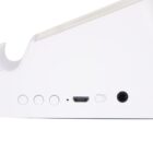 Close-up of a white electronic device showing a row of buttons and ports. From left to right: three circular buttons, a small hole, a micro USB port labeled DC IN, an auxiliary port labeled AUX, and a toggle switch labeled OFF/ON.
