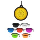 A collection of foldable pet bowls in various colors, including black, white, blue, green, yellow, red, purple, orange, and pink. Each has a black rim and a keychain clip attached. The yellow bowl at the top shows the Vision Australia logo.