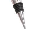 Close-up of a shiny metal wine bottle stopper with a conical shape. The stopper has multiple black rubber rings around its body for sealing. The background is plain white.